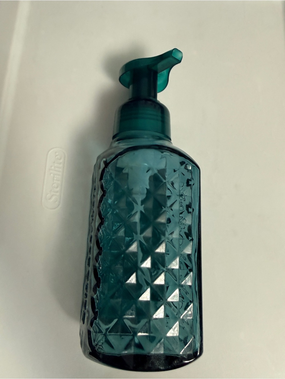 Bath and Body Works Faceted Green Glass foaming hand soap dispenser.